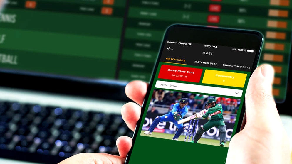 hand holding a smart phone with cricket betting mobile app open on it