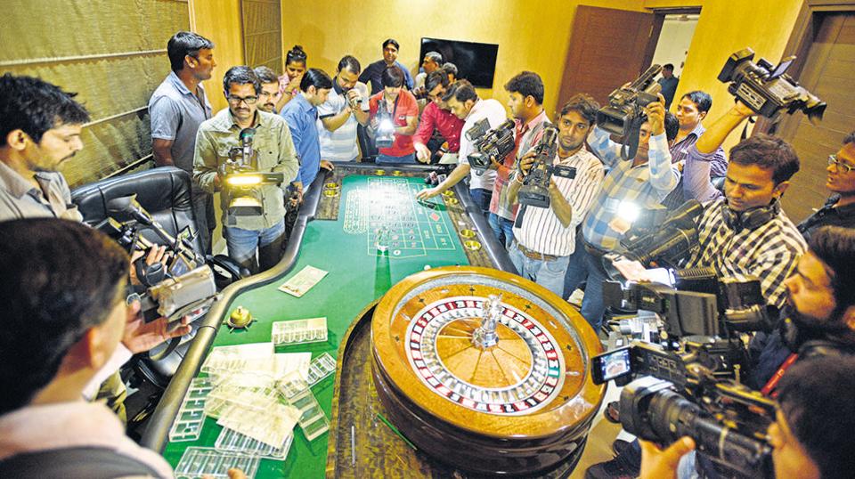 Roulette table with cameramen filming the gambling activity